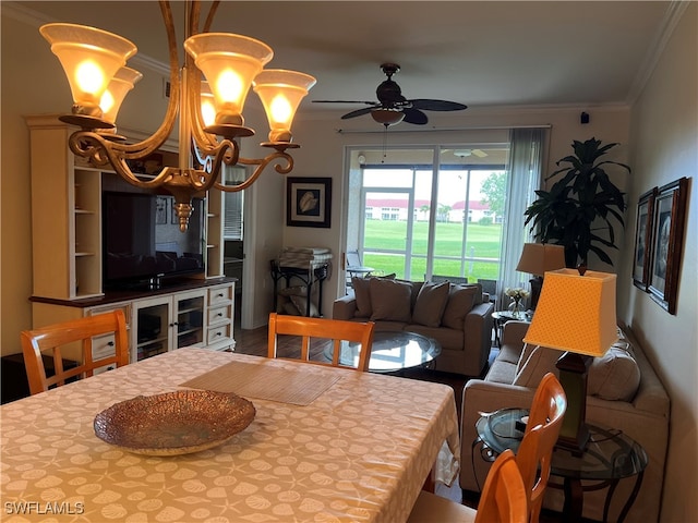 dining room with crown molding, hardwood / wood-style flooring, and ceiling fan with notable chandelier