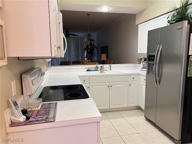 kitchen with white cabinets, sink, stove, and stainless steel fridge with ice dispenser