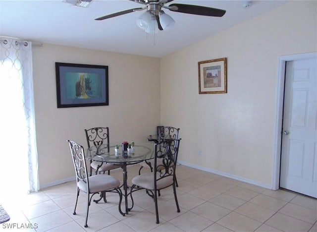 dining room featuring ceiling fan and light tile patterned floors