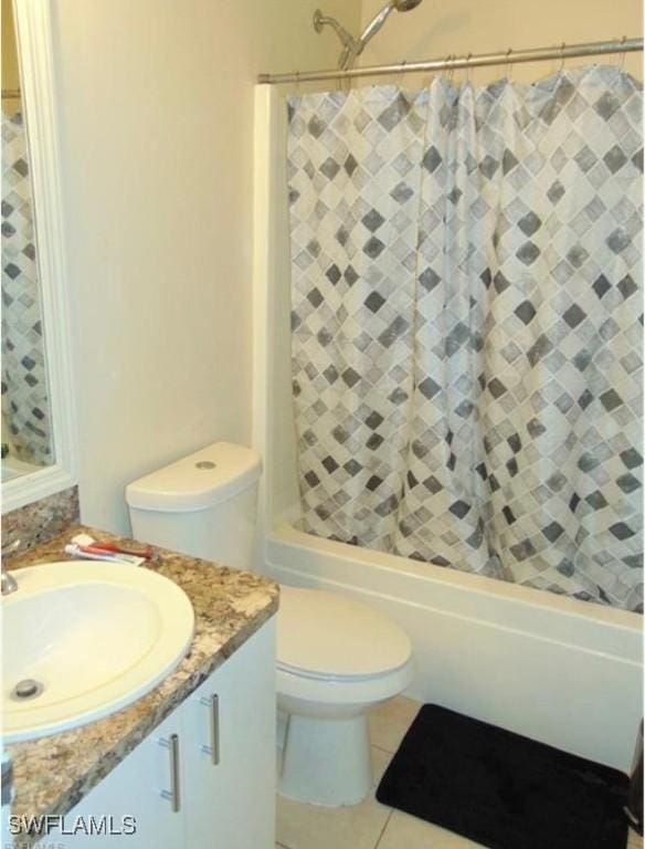 full bathroom featuring shower / tub combination, tile patterned floors, vanity, and toilet