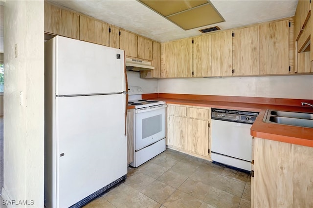 kitchen with light tile patterned floors, sink, white appliances, and light brown cabinetry