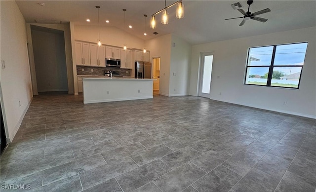 interior space with ceiling fan, high vaulted ceiling, and sink