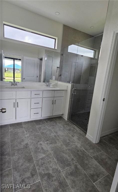 bathroom featuring vanity and walk in shower