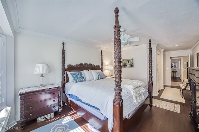 bedroom with crown molding, ceiling fan, and dark hardwood / wood-style flooring