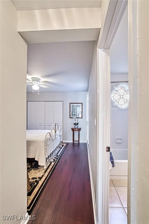 corridor featuring hardwood / wood-style floors