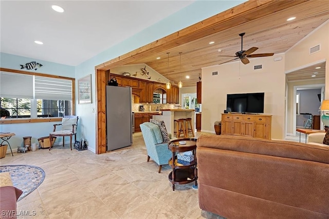 living room featuring ceiling fan, vaulted ceiling, wood ceiling, and light tile patterned flooring