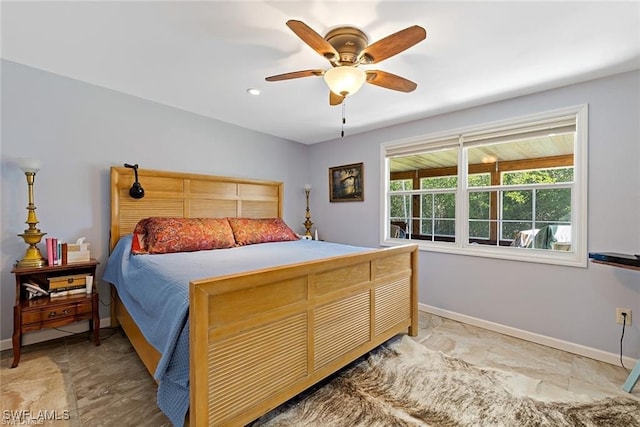 bedroom featuring ceiling fan and light tile patterned flooring