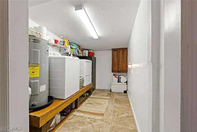 utilities featuring electric water heater and independent washer and dryer