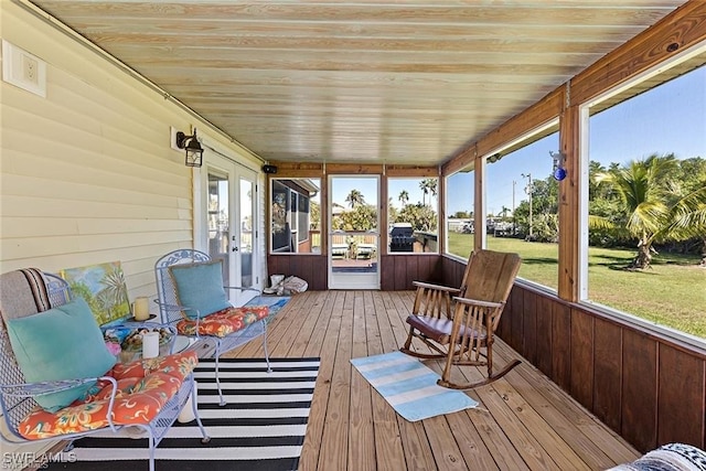 sunroom with wooden ceiling and french doors