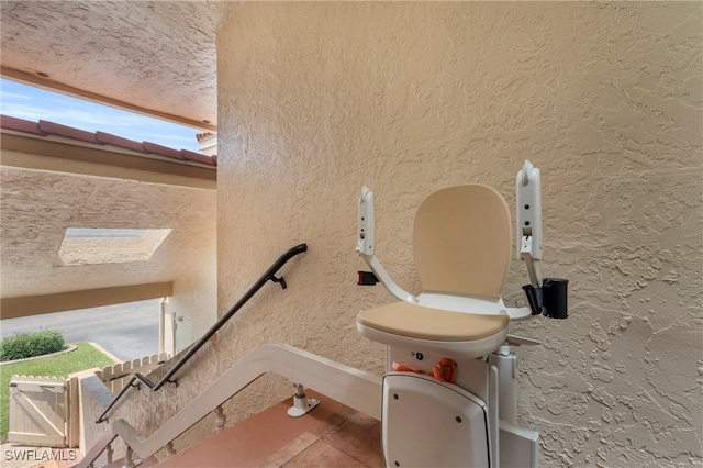 details with a skylight and a textured ceiling