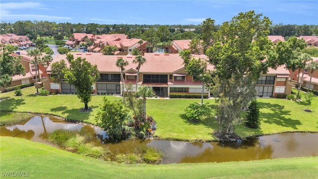 drone / aerial view with a water view