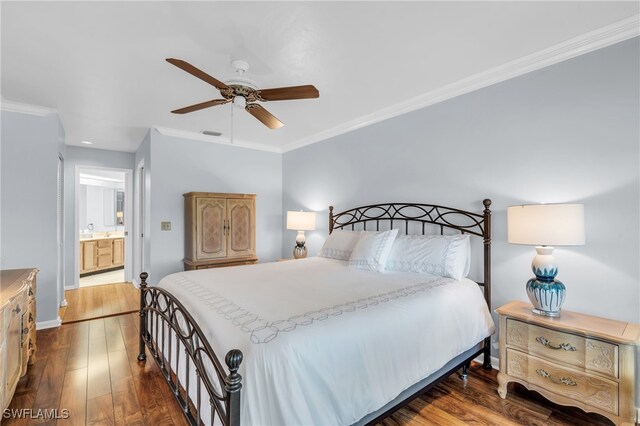 bedroom featuring ceiling fan, ensuite bathroom, dark hardwood / wood-style floors, and ornamental molding