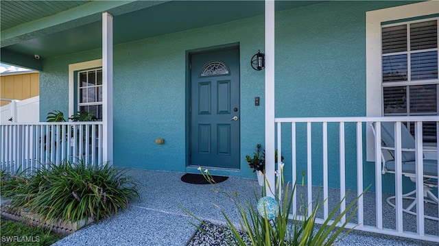 doorway to property with covered porch