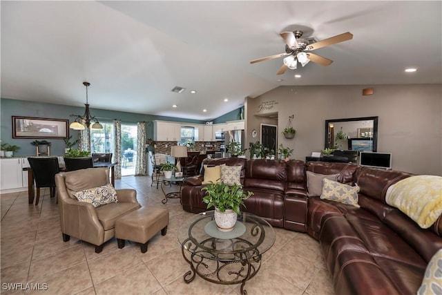 living room featuring light tile patterned floors, ceiling fan with notable chandelier, and lofted ceiling