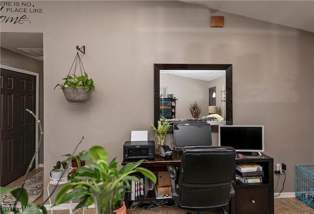 home office with lofted ceiling