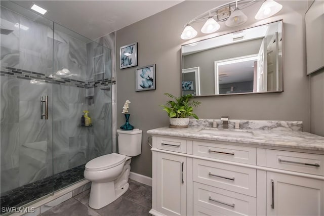 bathroom featuring vanity, toilet, and walk in shower