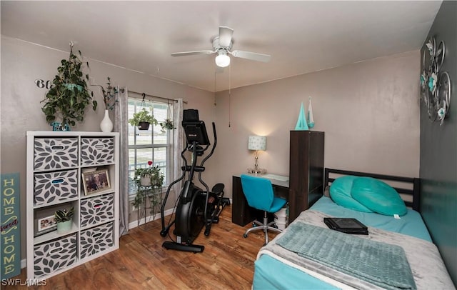 bedroom featuring hardwood / wood-style flooring and ceiling fan