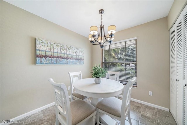 dining area featuring an inviting chandelier