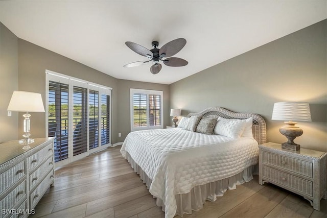 bedroom with light wood-type flooring, access to outside, and ceiling fan