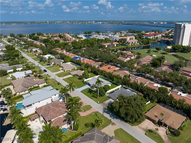 birds eye view of property featuring a water view