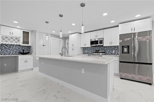 kitchen featuring sink, stainless steel appliances, light tile patterned floors, and backsplash