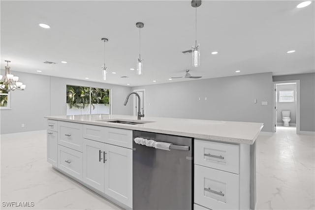 kitchen with sink, pendant lighting, white cabinetry, and stainless steel dishwasher