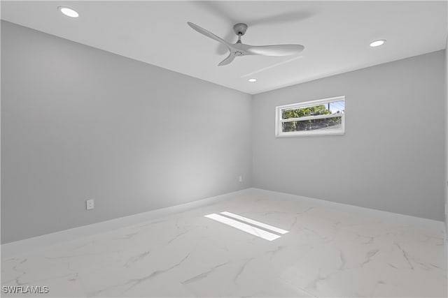 tiled empty room with ceiling fan