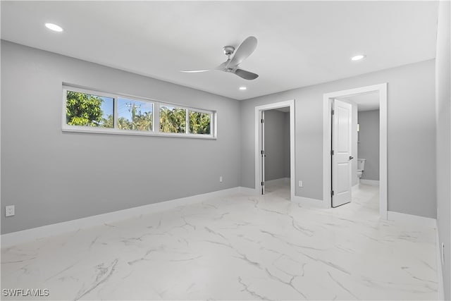 unfurnished bedroom featuring a spacious closet, ceiling fan, and light tile patterned flooring