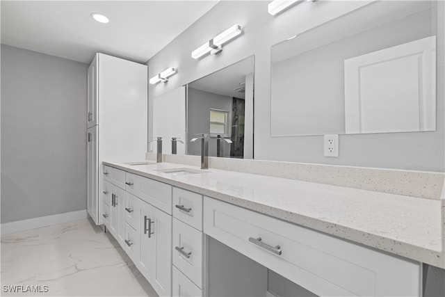 bathroom with tile patterned floors and vanity