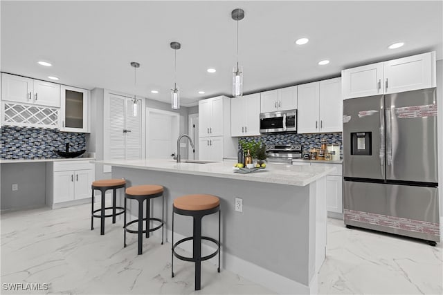 kitchen featuring sink, appliances with stainless steel finishes, and light tile patterned flooring