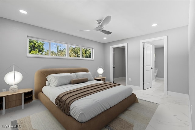 tiled bedroom featuring ceiling fan and connected bathroom