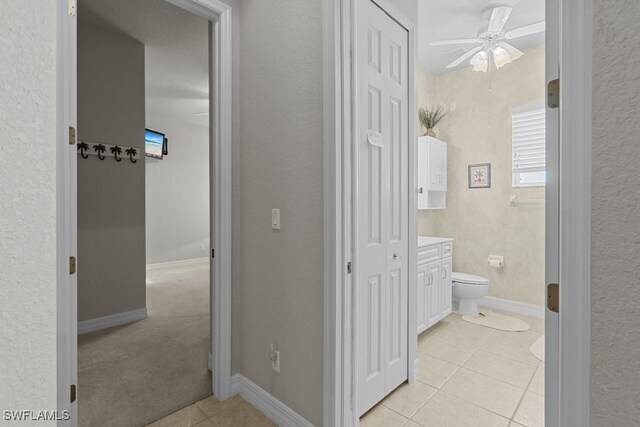 bathroom featuring vanity, toilet, tile patterned floors, and ceiling fan