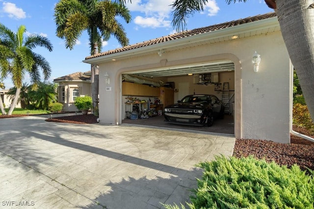 view of car parking with an attached garage and concrete driveway