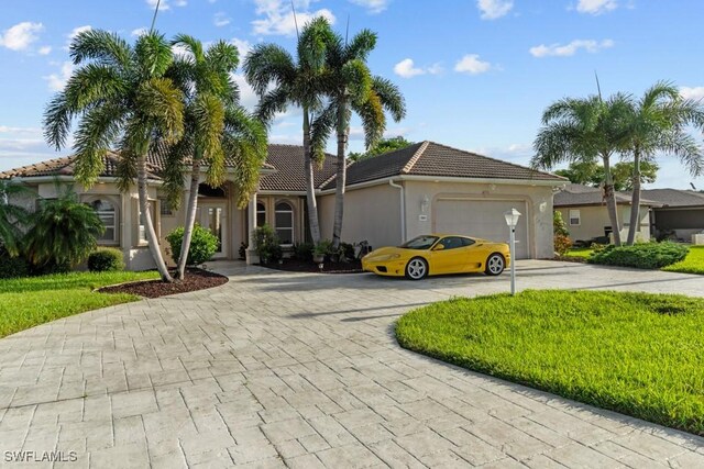 mediterranean / spanish house featuring a garage