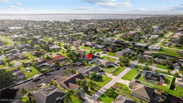 aerial view with a residential view and a water view