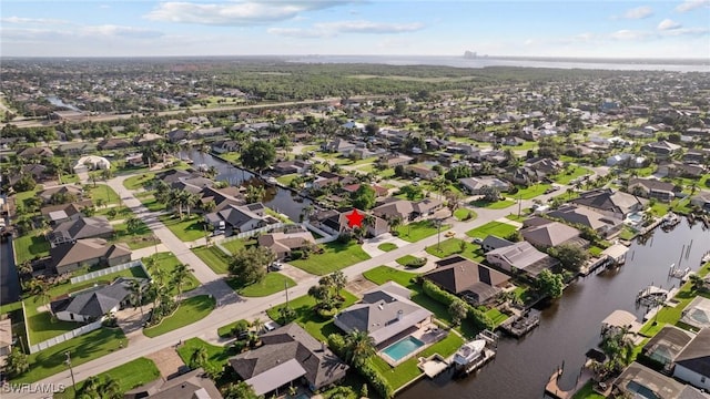 aerial view featuring a water view and a residential view