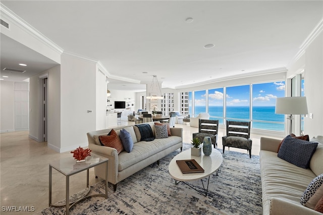 living room with a water view and crown molding