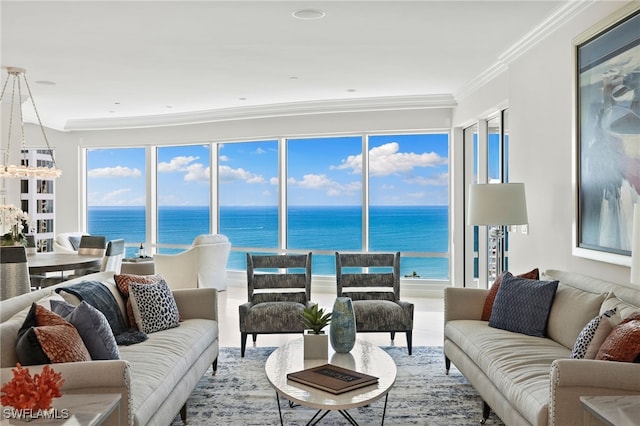 living room with ornamental molding, a water view, and a healthy amount of sunlight