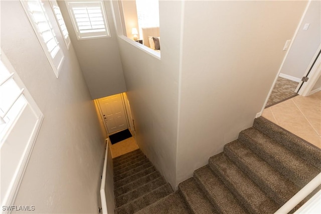 staircase with tile patterned flooring