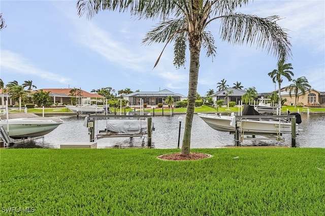 dock area featuring a yard and a water view