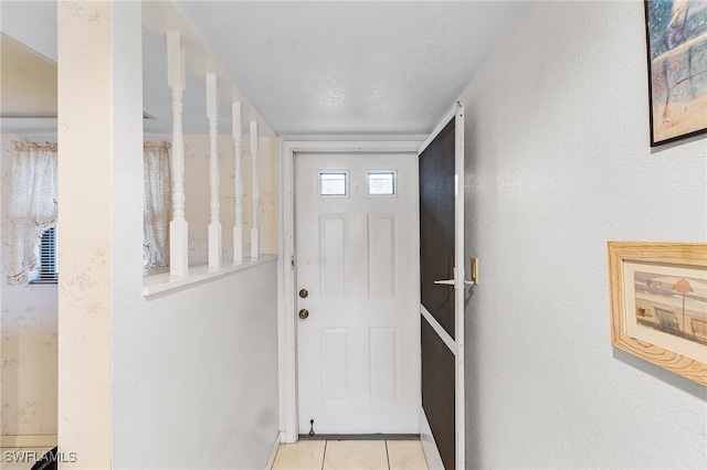 doorway featuring light tile patterned floors