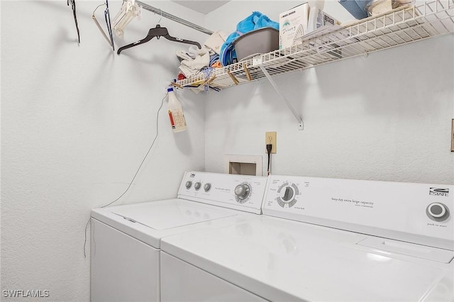 laundry area featuring laundry area and washing machine and clothes dryer