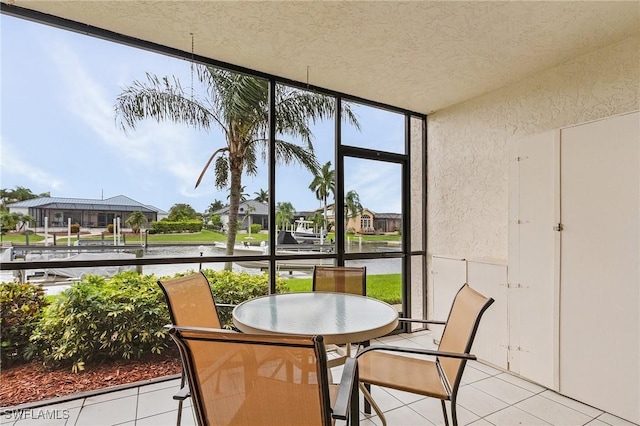 sunroom featuring a residential view