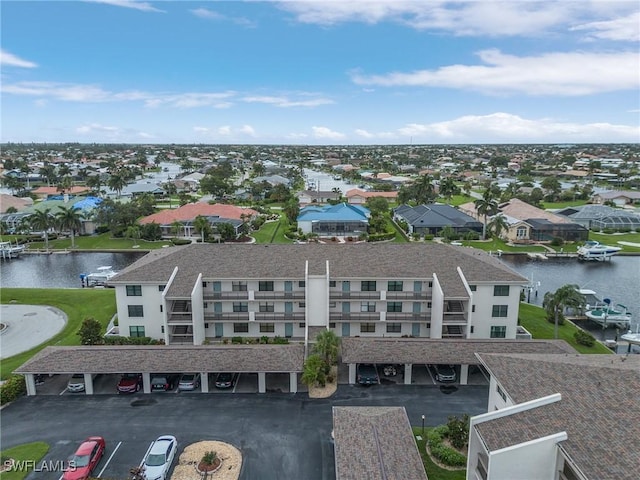 aerial view with a water view and a residential view