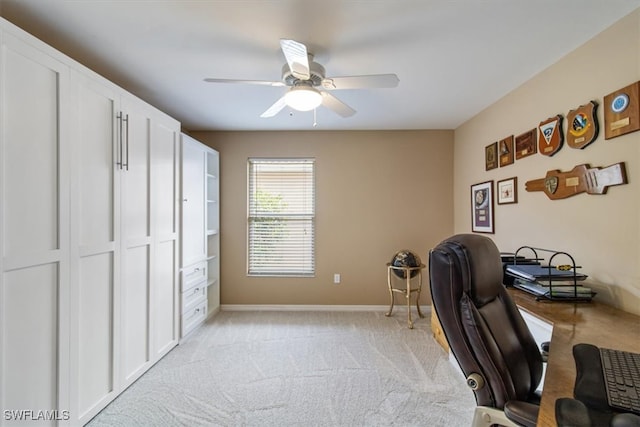 carpeted home office with ceiling fan