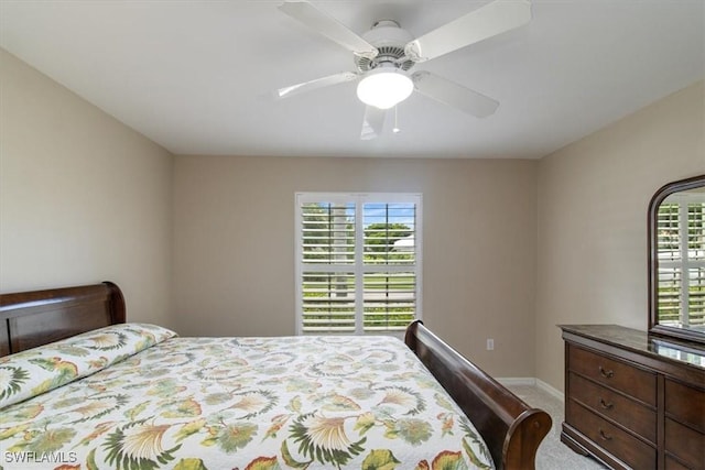 bedroom with ceiling fan and carpet