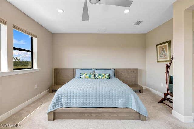 carpeted bedroom with ceiling fan