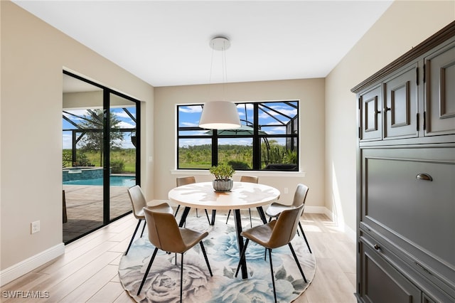 dining room with light wood-type flooring