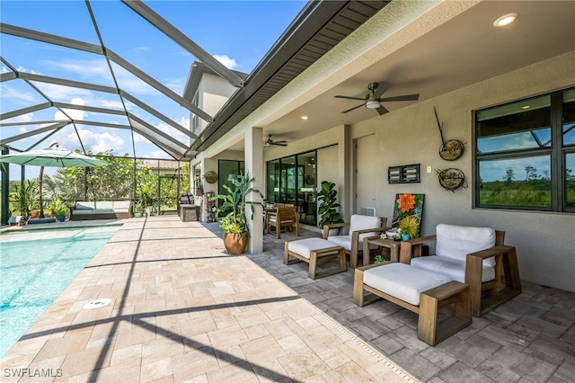 view of patio / terrace featuring glass enclosure, ceiling fan, and outdoor lounge area