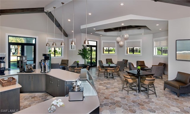 interior space with high vaulted ceiling, beam ceiling, and a wealth of natural light